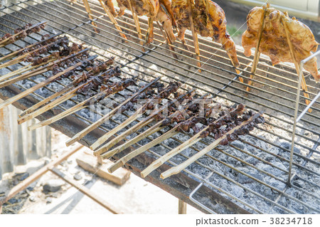 Grilled chicken and grilled liver on the grill. Grilled chicken and grilled liver on the grill. 38234718