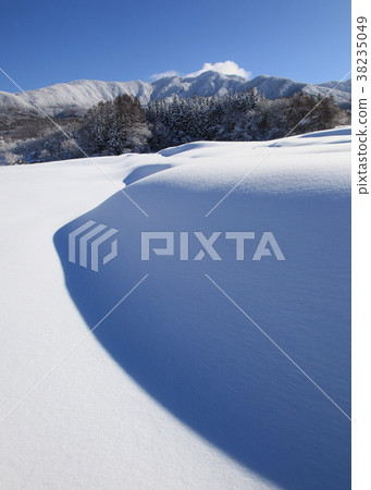 Snow figure and winter mountain 38235049