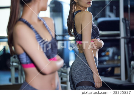 Woman checking gym gym body line 38235827