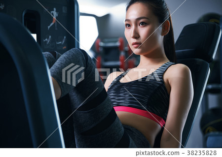 Gym leg press machine woman 38235828