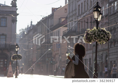 Closeup shot of black girl drinking wine outside Closeup shot of black girl drinking wine outside 38236917