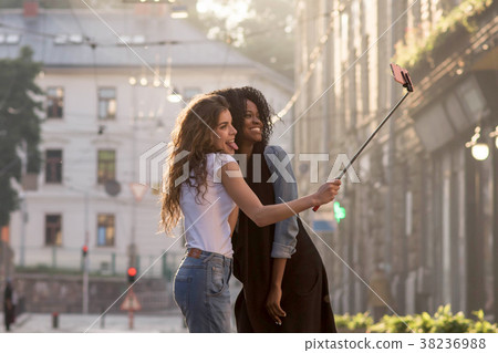 Two young and attractive girls making selfie on Two young and attractive girls making selfie on 38236988