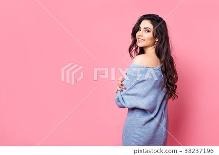 Smiling woman dressed in blue knitted sweater 38237196