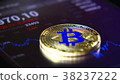 Golden bitcoins on the background of a graphic 38237222
