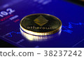 Gold coins of the ethereum on the background of a 38237242