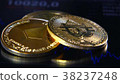 Golden bitcoins on the background of a graphic 38237248