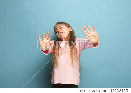 The disgust. Teen girl on a blue background The disgust. Teen girl on a blue background 38238185