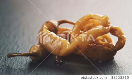 chilli hot pepper marinated on slate 38238219