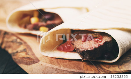 burritos with beef steak, corn, black beans and burritos with beef steak, corn, black beans and 38238263