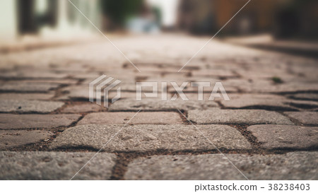perspective view of old paved road in town perspective view of old paved road in town 38238403
