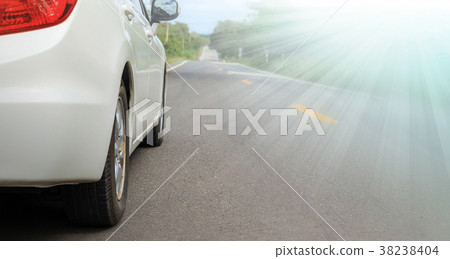 white car and light on asphalt road 38238404
