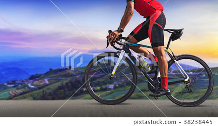 Man on a bicycle on a road Man on a bicycle on a road 38238445