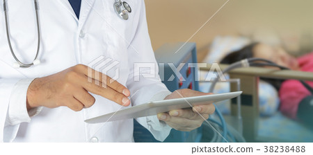 Doctor using a digital tablet Doctor using a digital tablet 38238488