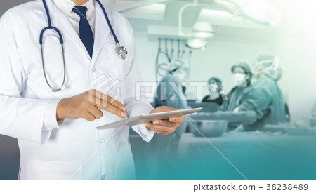 Doctor using a digital tablet Doctor using a digital tablet 38238489