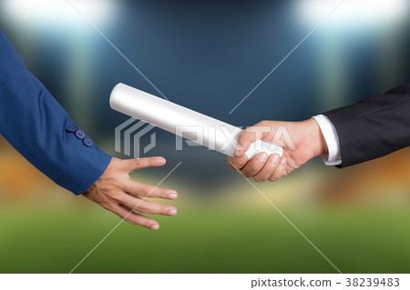 Businessman passing relay baton to colleague 38239483