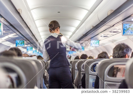 Interior of commercial airplane with stewardess 38239983