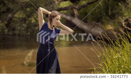 A young girl by the river 38241773