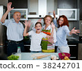 Grandparents, parents and children baking in the 38242701
