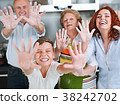 Grandparents, parents and children baking in the 38242702