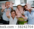 Grandparents, parents and children baking in the 38242704