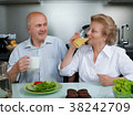Happy senior couple preparing healthy vegetarian 38242709