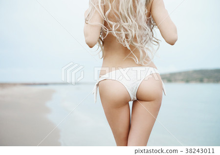 Beautiful slender blonde at the sea 38243011