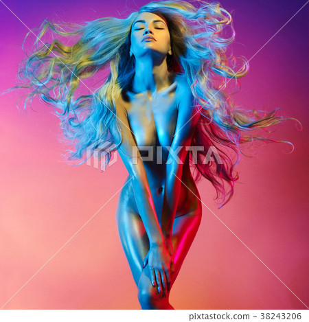 Nude sexy blonde in colorful light. 38243206