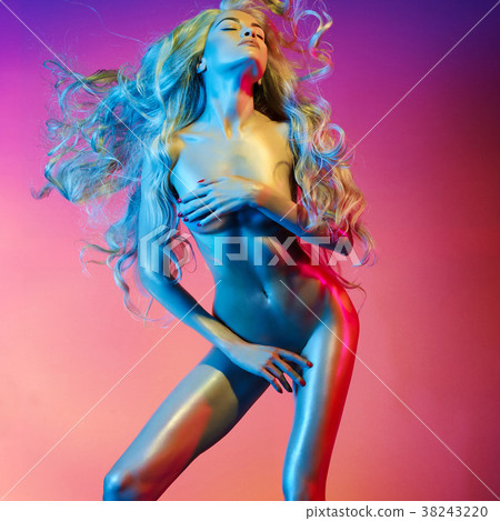 Nude sexy blonde in colorful light. 38243220