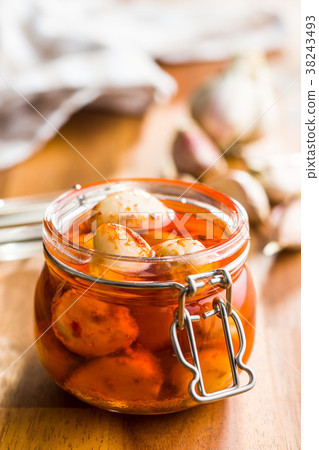 Tasty preserved garlic. 38243493