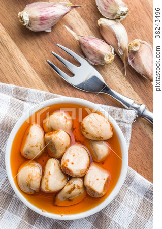 Tasty preserved garlic. 38243496