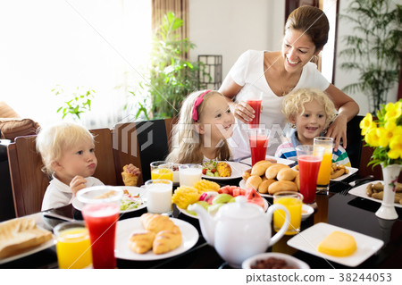 Healthy family breakfast for mother and kids. 38244053