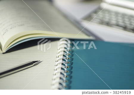 Notebook and pen and book 38245919