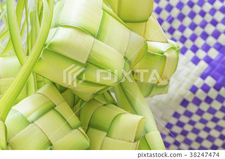 Natural rice wrapped with young coconut leave. 38247474