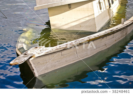 Sinking white boat Sinking white boat 38248461