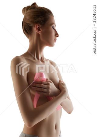 Woman with pink breast cancer awareness ribbon 38249512
