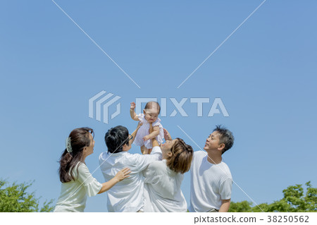 Three generation family playing in the park 38250562