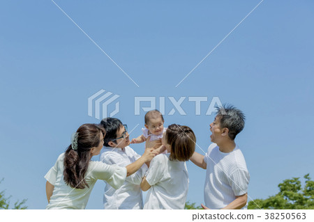 Three generation family playing in the park 38250563