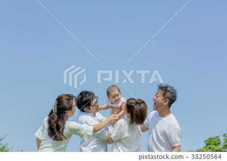 Three generation family playing in the park 38250564