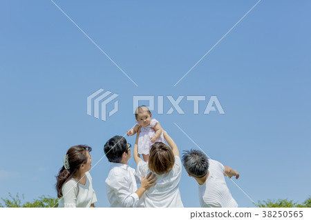 Three generation family playing in the park 38250565