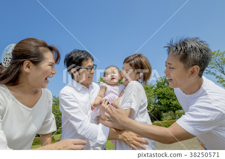 Three generation family playing in the park 38250571