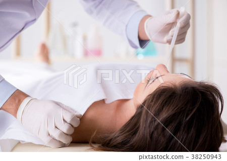 Police coroner examining dead body corpse in 38250943