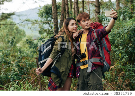 Couple photographing in forest 38251759