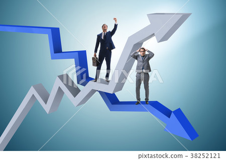 Businessman with charts of growth and decline 38252121