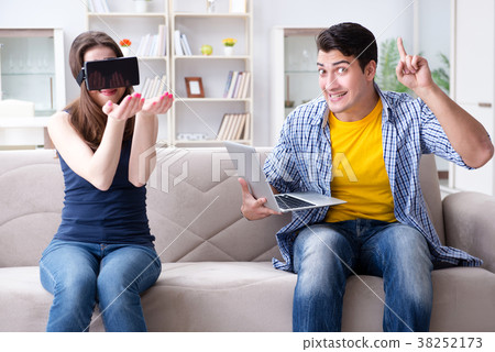 Young family playing games with virtual reality Young family playing games with virtual reality 38252173