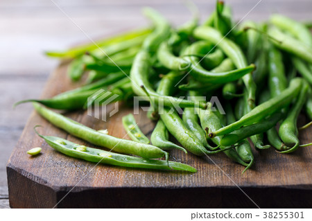 Green beans on cutting board. Go green concept. Green beans on cutting board. Go green concept. 38255301