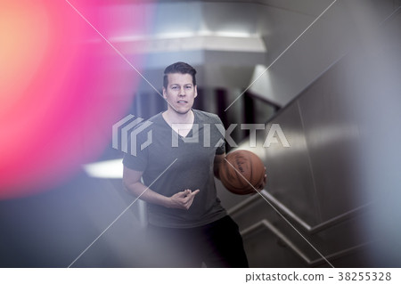 Man Walking Up Stairs With a Basketball Man Walking Up Stairs With a Basketball 38255328