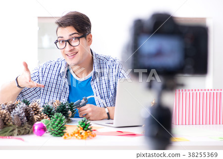 Young vlogger recording video doing christmas 38255369