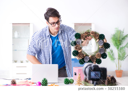 Young vlogger recording video doing christmas 38255380