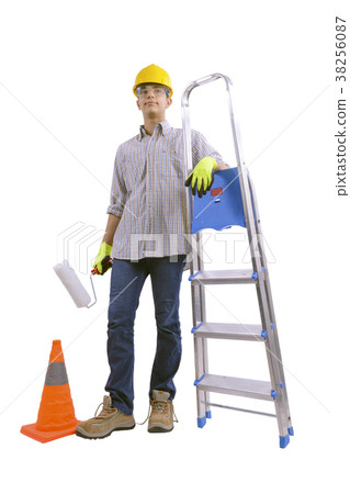 Young male decorator painting with a paint roller. Young male decorator painting with a paint roller. 38256087