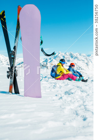 Photo of snowboard, skis on background of sitting 38256750
